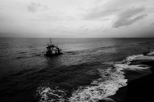 Boat and Waves in a Sea in Black and White 