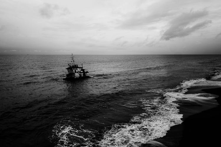 Boat And Waves In A Sea In Black And White 