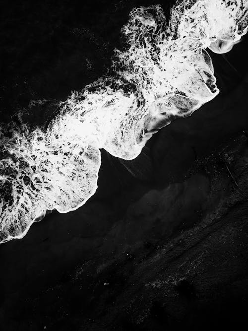 Waves in a Sea Seen From Above in Black and White