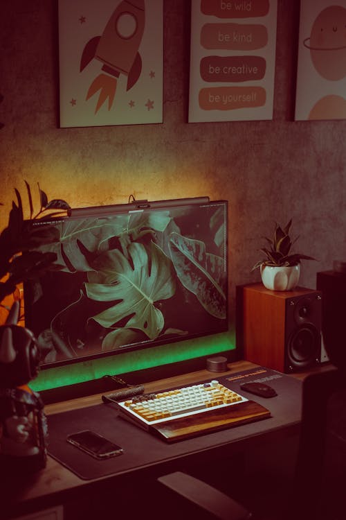 A Computer and a Speaker Set on the Desk 