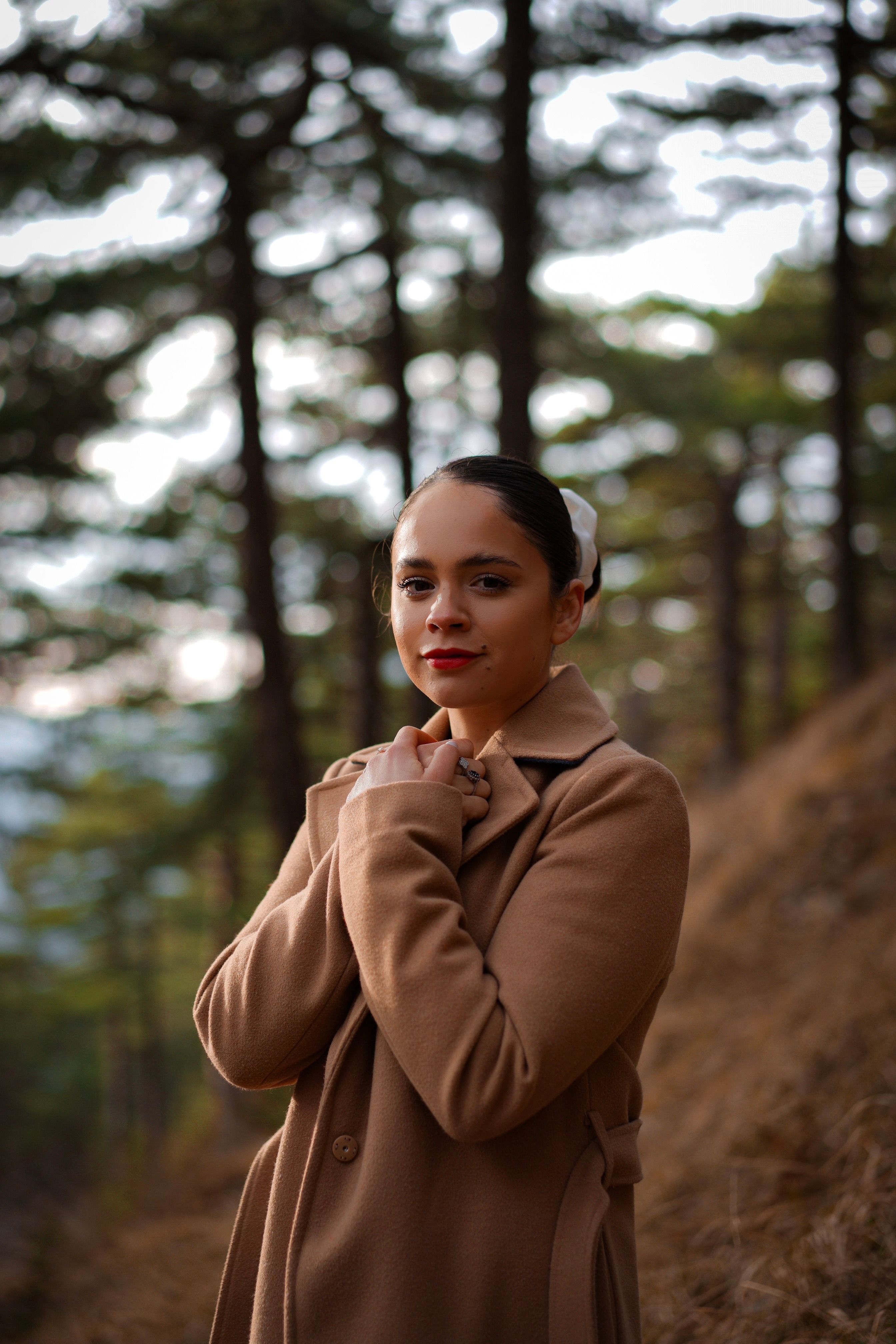 Woman Wearing Trench Coat in a Forest · Free Stock Photo