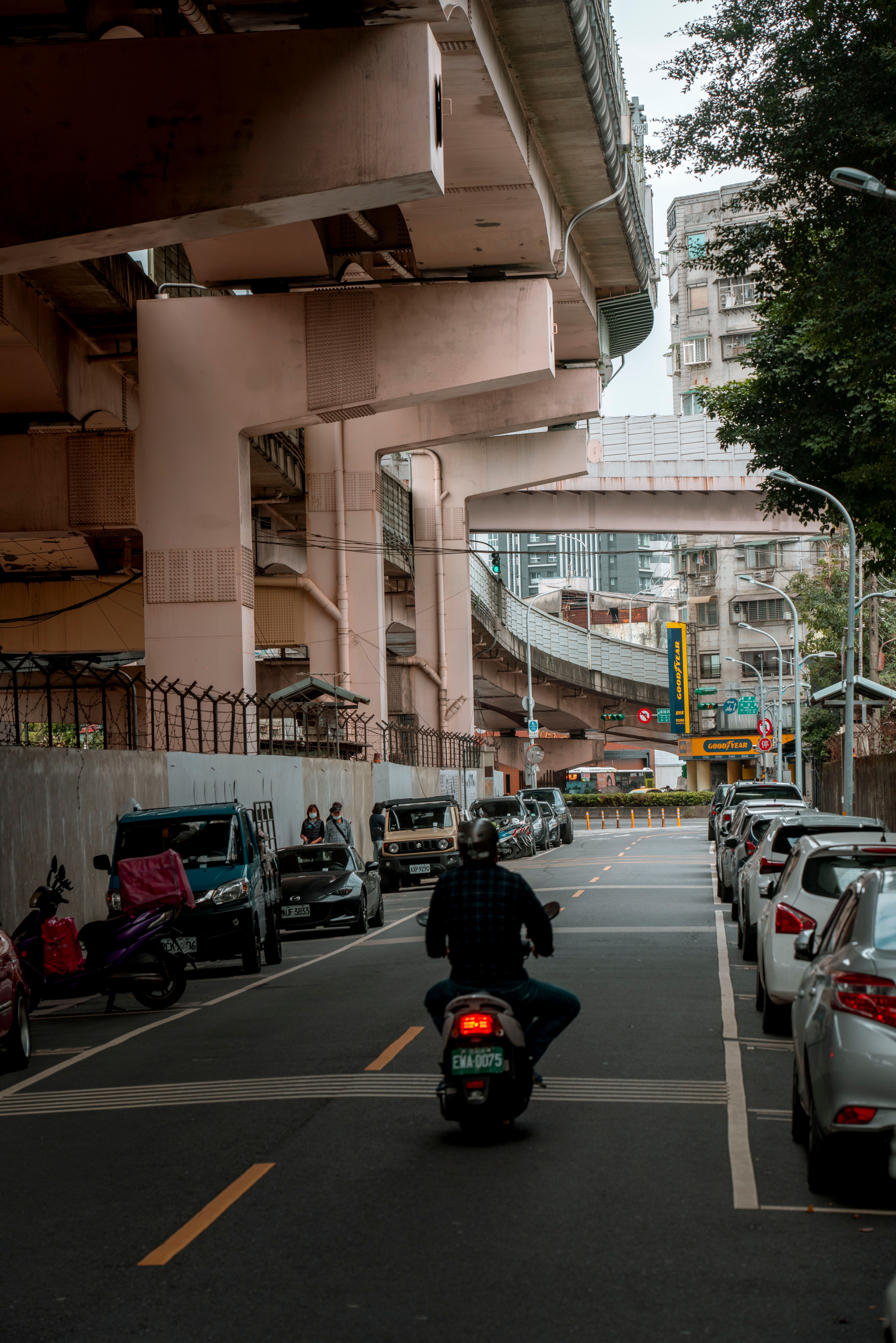 Person Riding Motorcycle on City Street · Free Stock Photo