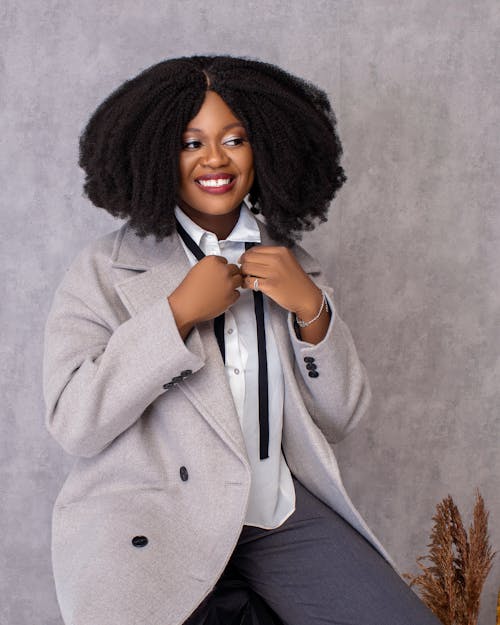 Elegant Woman Sitting Wearing Coat