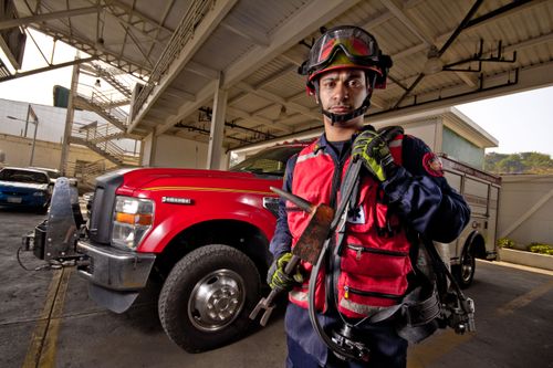 A firefighter's uniform and helmet at a fire station