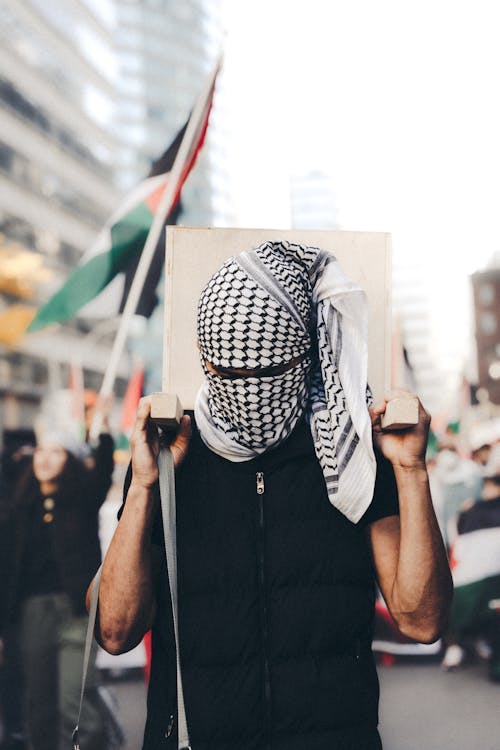 Free Man Wearing a Keffiyeh on a Palestinian Protest Stock Photo