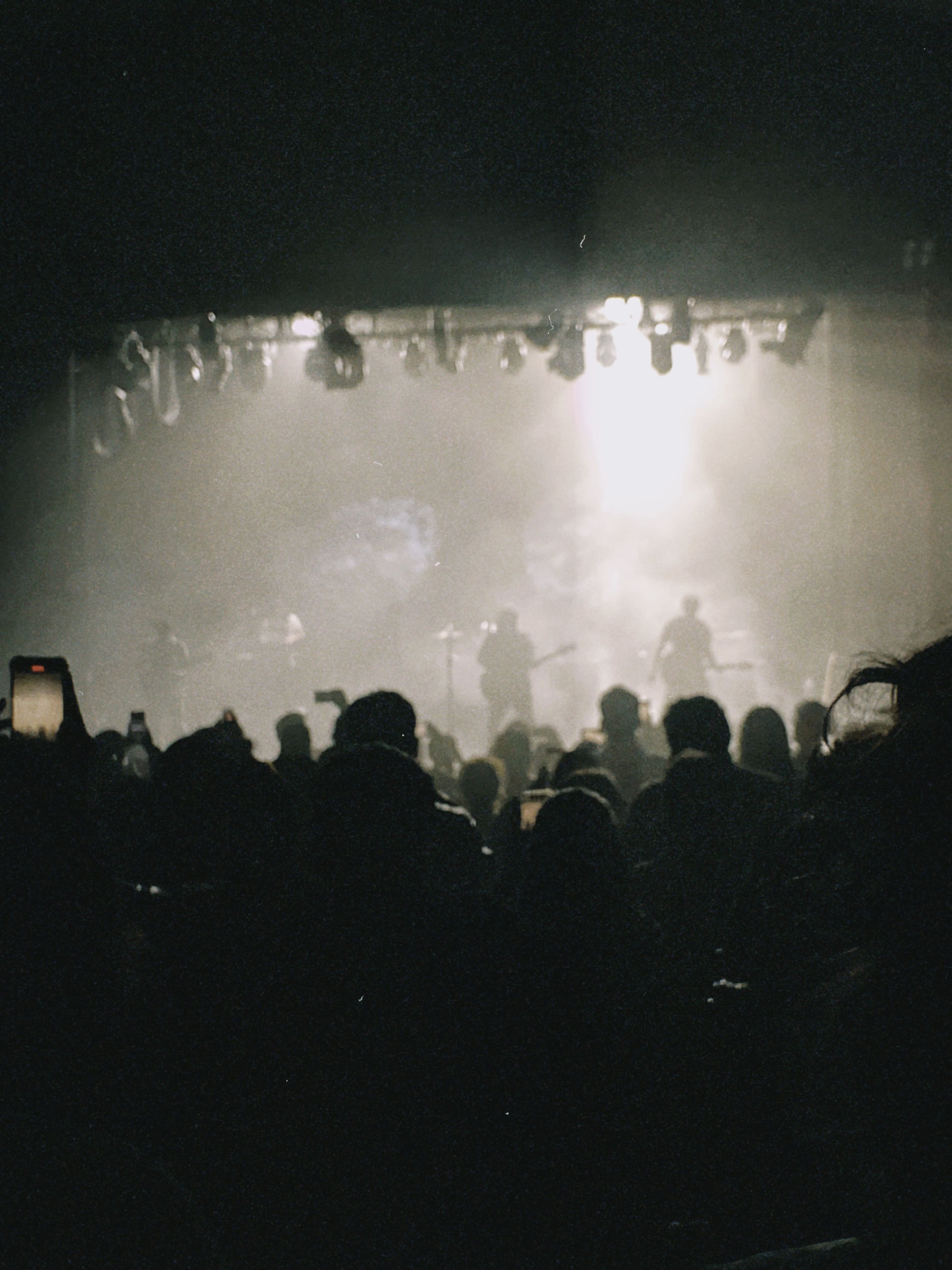 Singer performing under stage lights