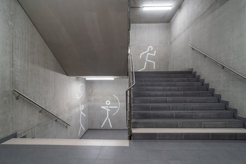 Simply Shaped People Painted on Wall