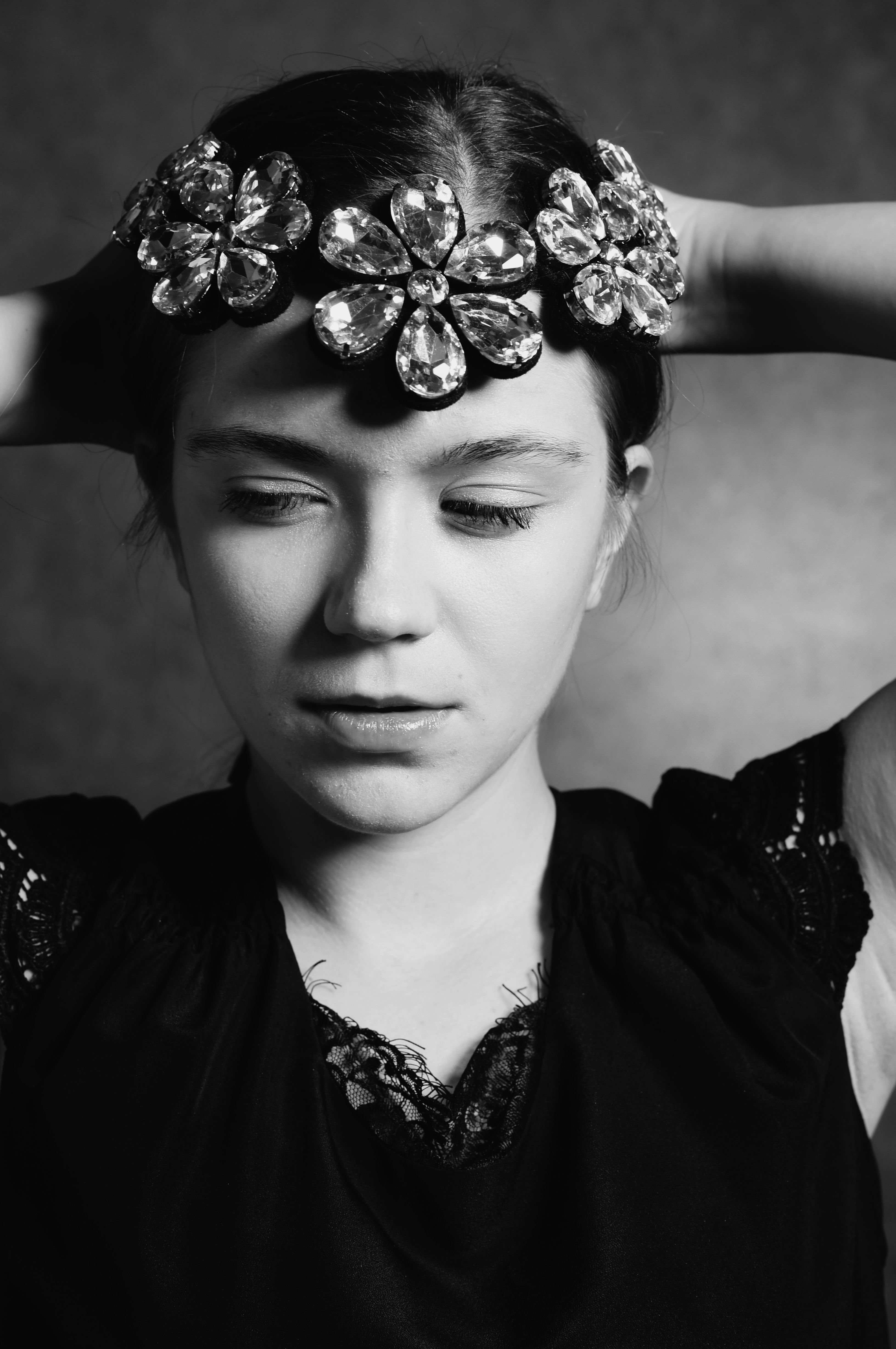 A black and white photo of a woman with flowers on her head · meta.free ...
