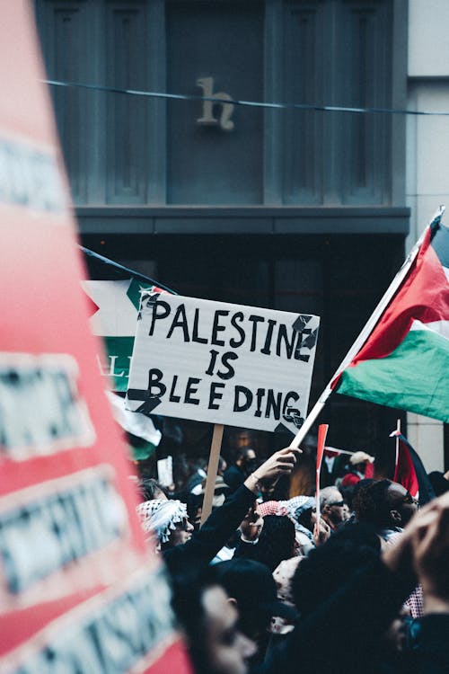 Free Crown with Banner on Demonstration for Palestine Stock Photo