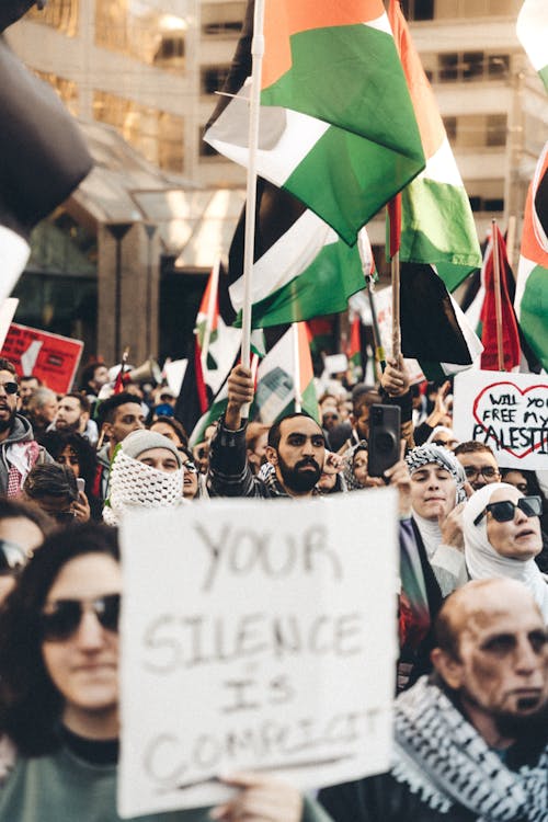 Protesting Crowd Carrying Flags and Banners