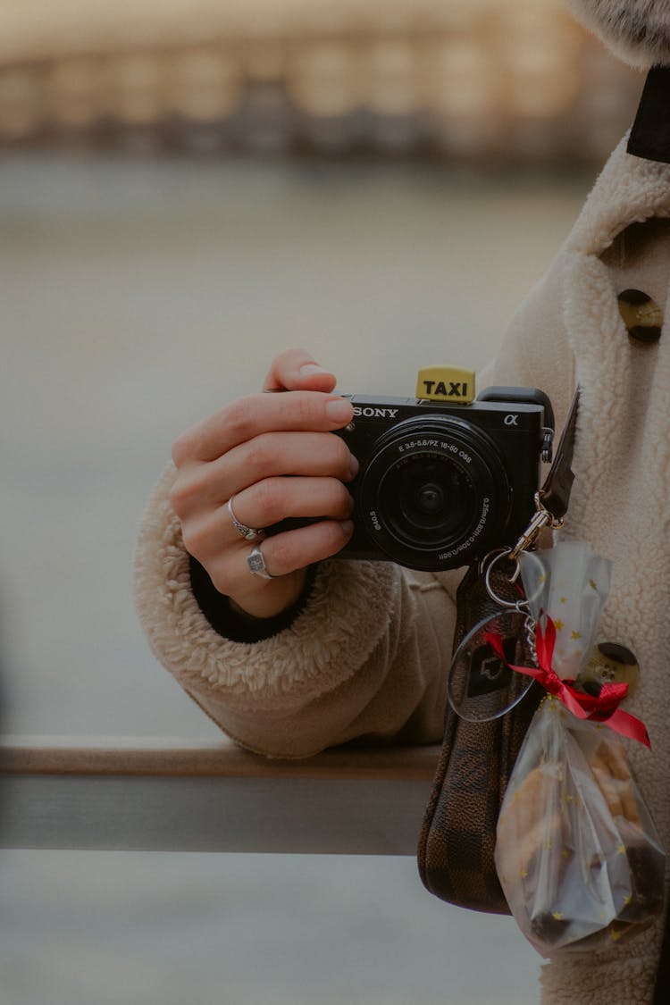 Woman Holding Digital Camera 