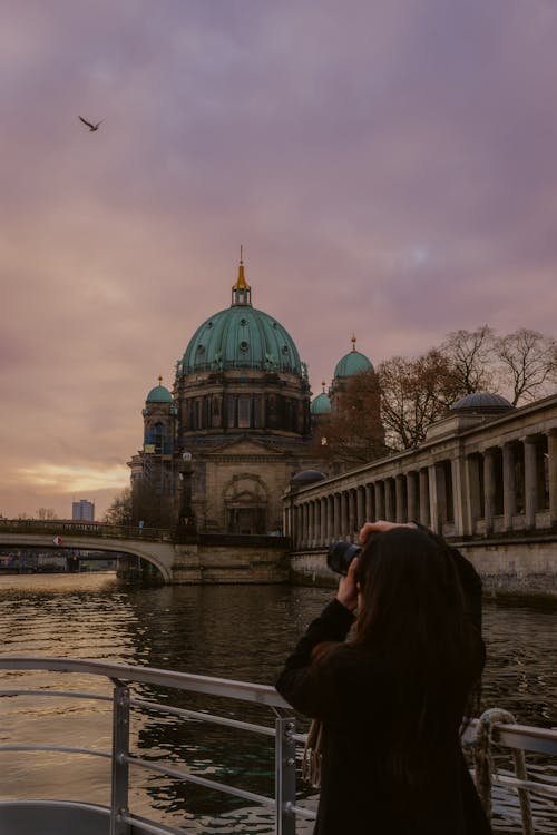 Woman Photographing Berlin Cathedral at Dawn