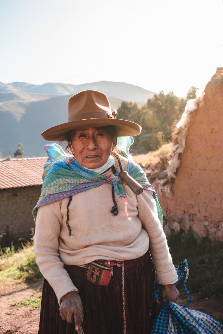 Elderly Woman In Beige Hat