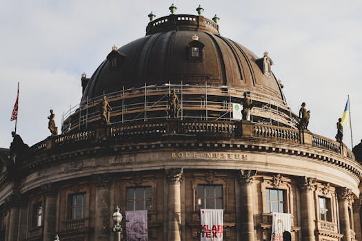 Close-up of Berlin's Bode Museum dome, showcasing scaffolding and historical architecture.