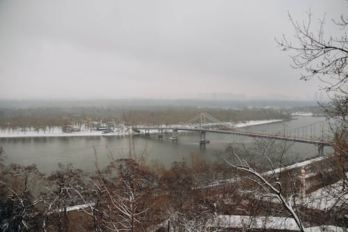 The bridge, snow and the Dnipro