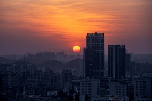 Foto profissional grátis de alvorecer, arranha-céus, cair da noite