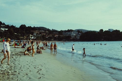 People Relax on Beach