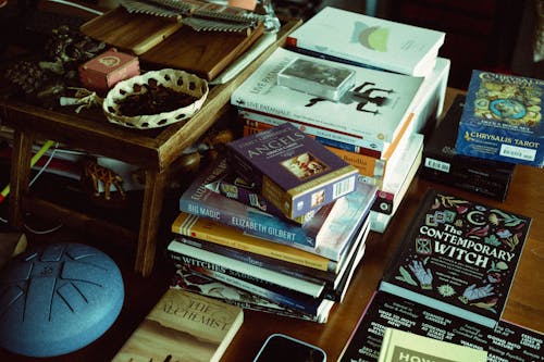 Tarot Deck atop Piles of Books