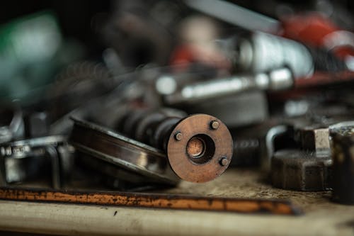 Busy Automobile Workshop: Mechanics at Work in a Garage