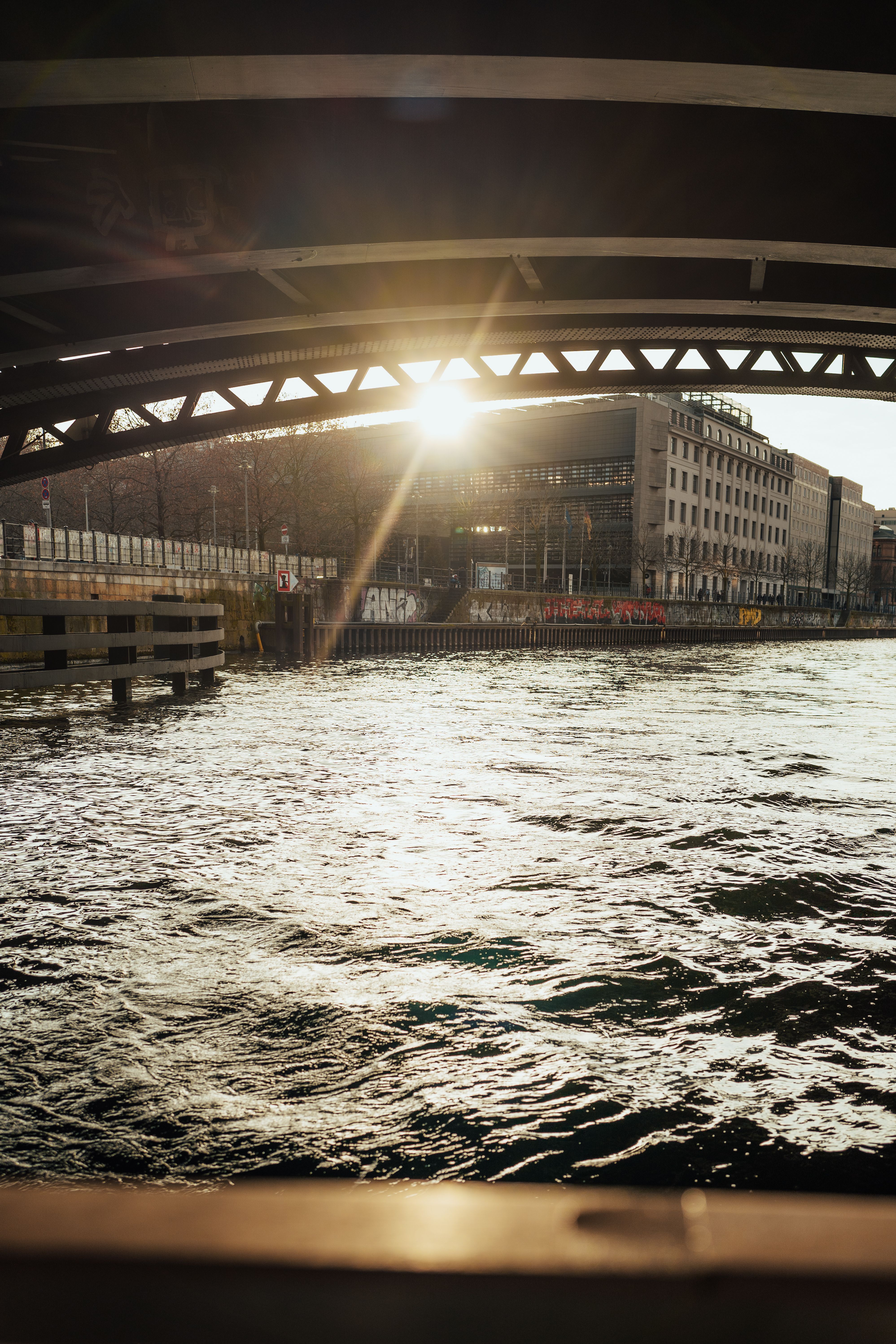 A view of the sun rising over a bridge · Free Stock Photo