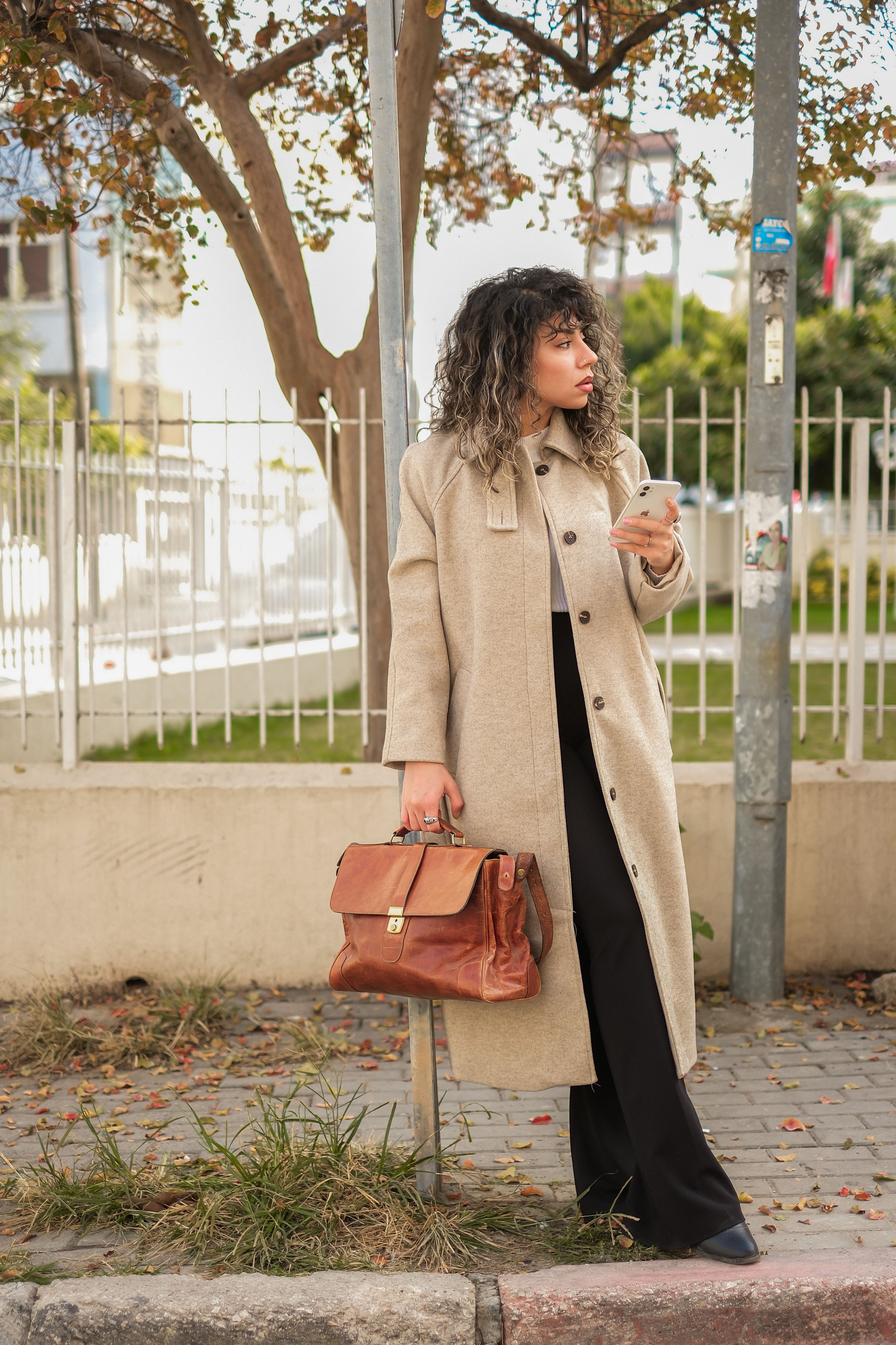 Woman Wearing Trench Coat on a Street · Free Stock Photo
