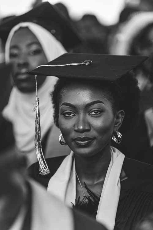 Free Elegant black and white portrait of a young woman at a university graduation ceremony. Stock Photo