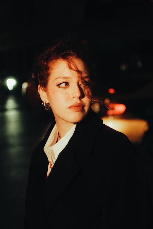 Portrait of a Young Woman on the Street at Night
