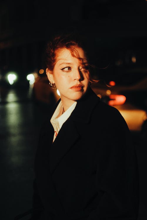 Portrait of a Young Woman in Wool Coat on the Street at Night