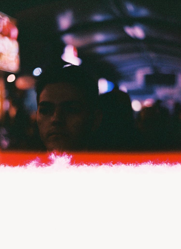 Defocused Film Photograph Of A Man In A Club 