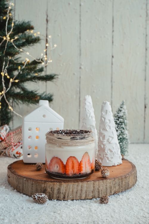 Free Delicious festive dessert with strawberries and Christmas decorations on a wooden base. Stock Photo