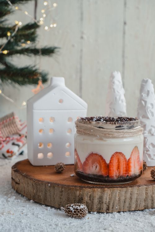 Free A festive dessert jar with strawberries and decorations, perfect for holiday celebrations. Stock Photo