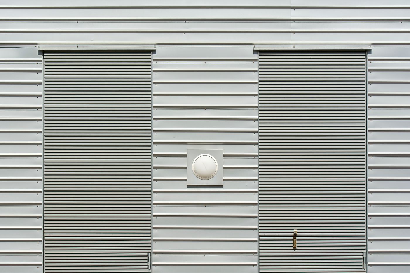 Building exterior with modern shutter systems