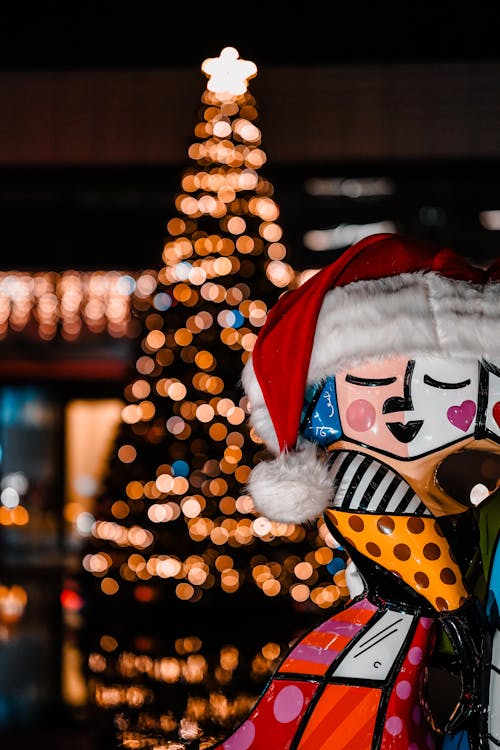 Photos gratuites de arbre de noël, bonnet de père noël, brillant