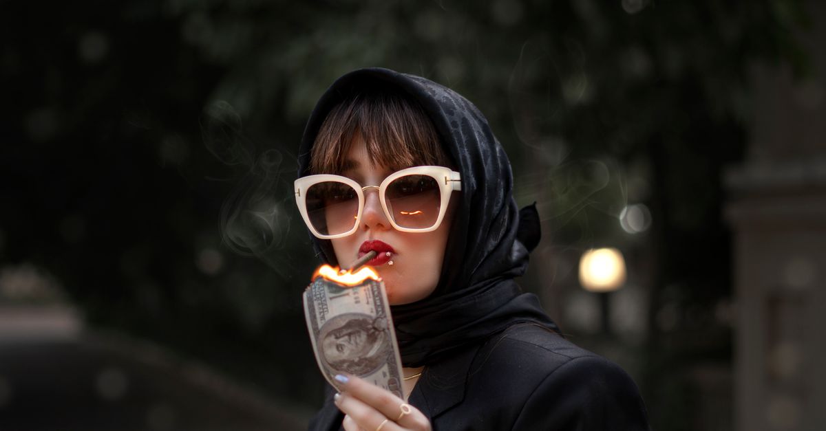 Woman In Hijab And Sunglasses Smoking And Burning Dollar Free Stock Photo woman-in-hijab-and-sunglasses-smoking-and-burning-dollar-free-stock-photo
