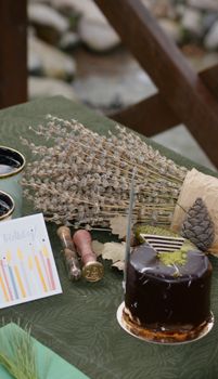 A cozy setup with chocolate cake, birthday card, and rustic decorations.