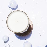 A poured candle seen from above on a pale surface — photo by Studio Naae on Pexels