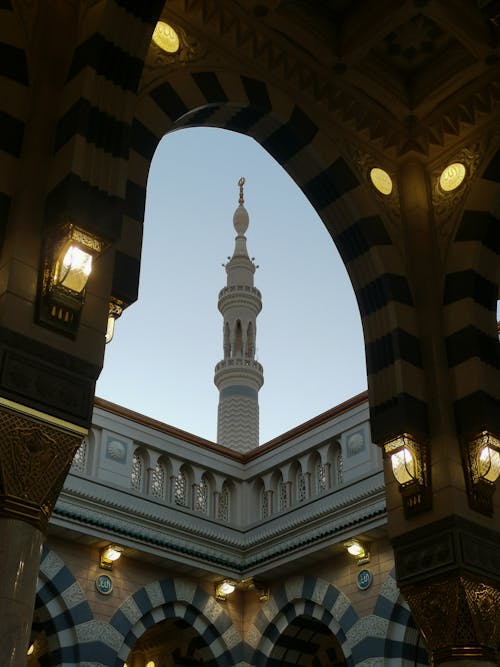 Photo of a Mosque with Arches and a Minaret