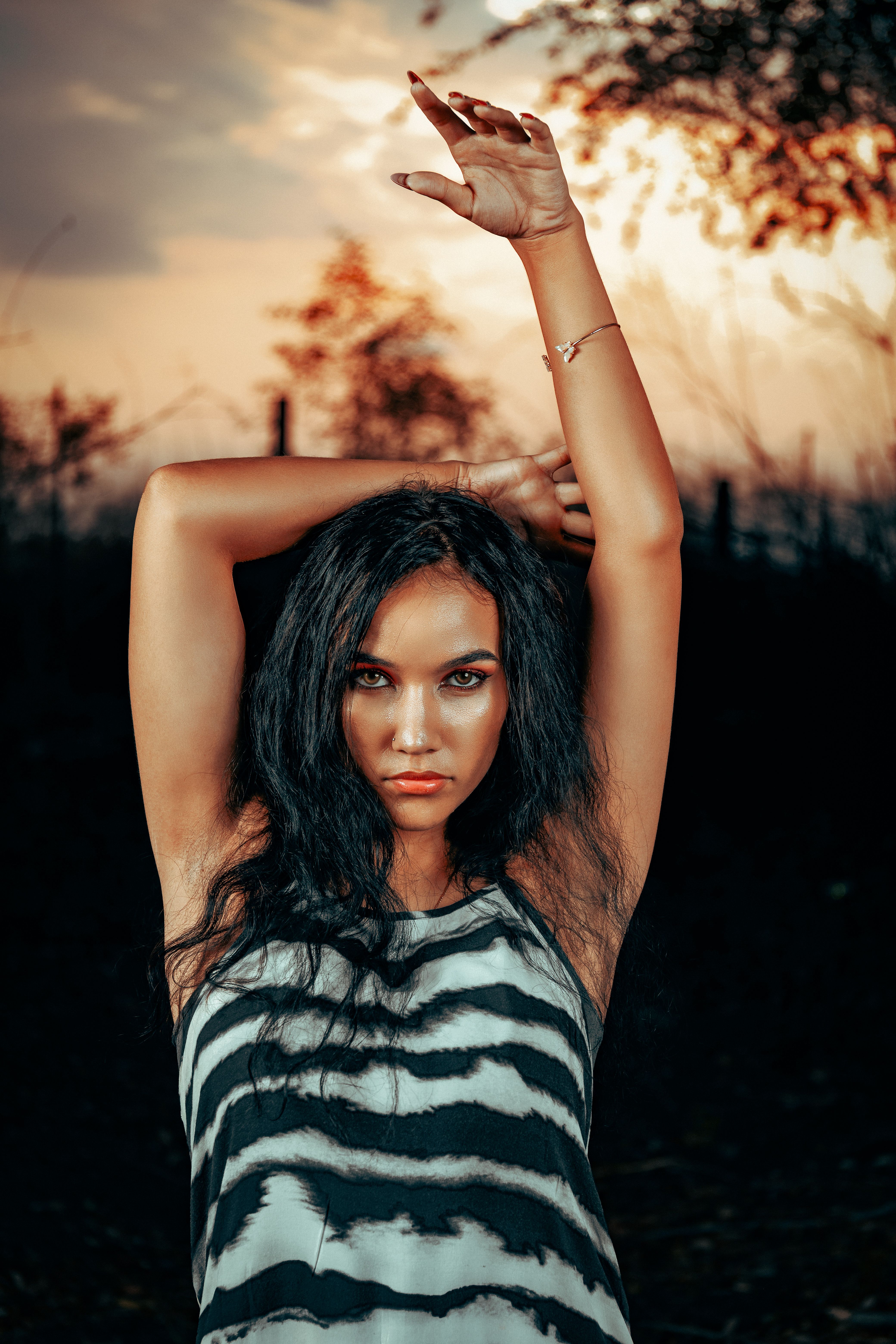 Young Woman Posing Outside at Sunset · Free Stock Photo