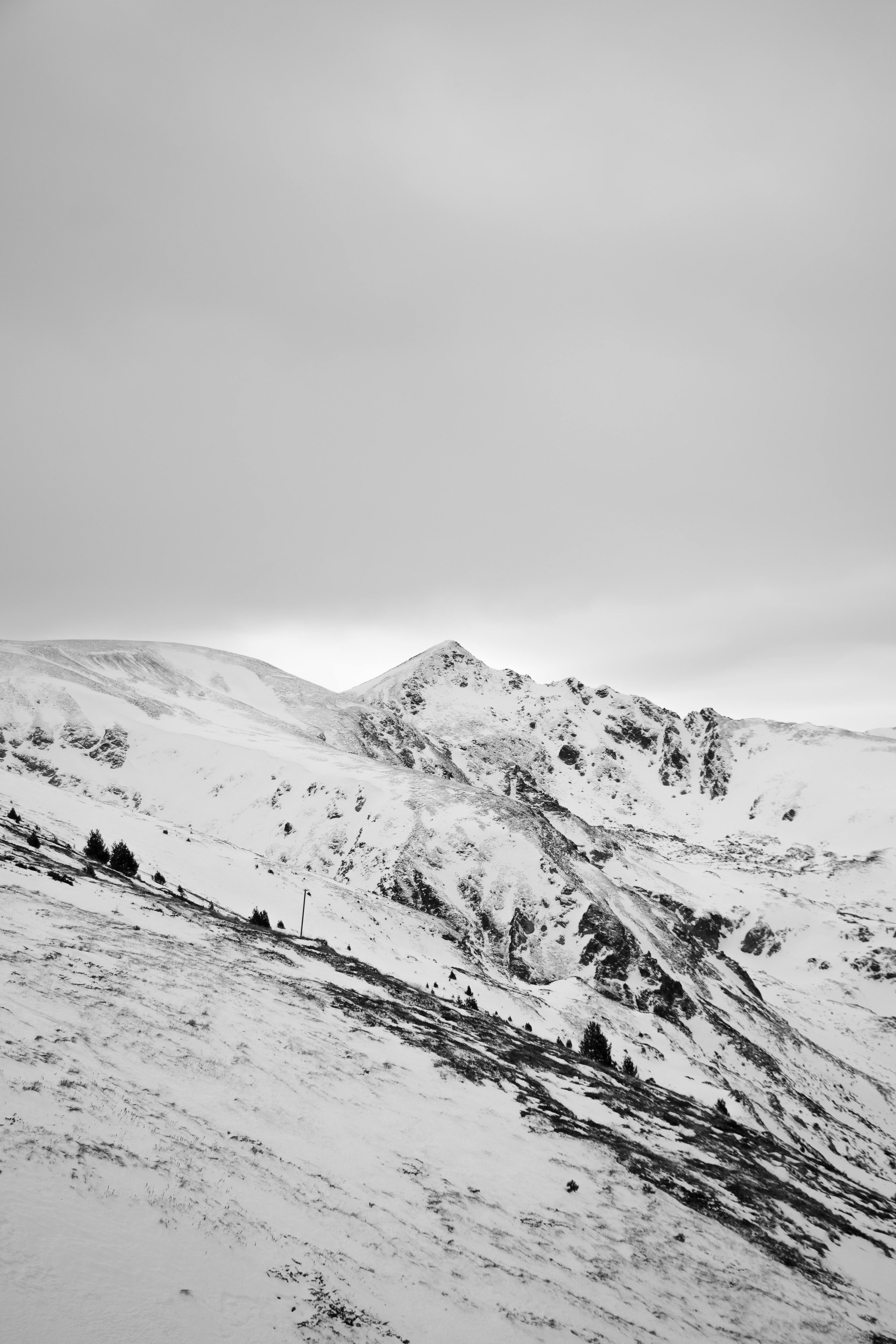 Black And White Photograph Of A Snowy Mountain · Free Stock Photo