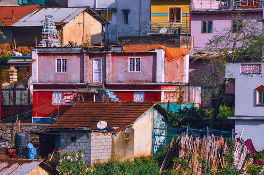 A colorful house is on top of a hill