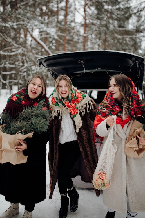 Laughing Women in Coats and Scarfs in Winter