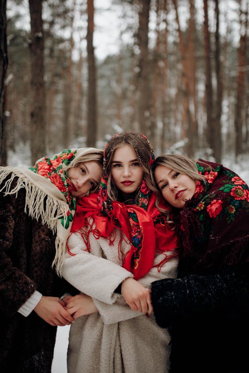 Beautiful Women in Coats Posing in Forest