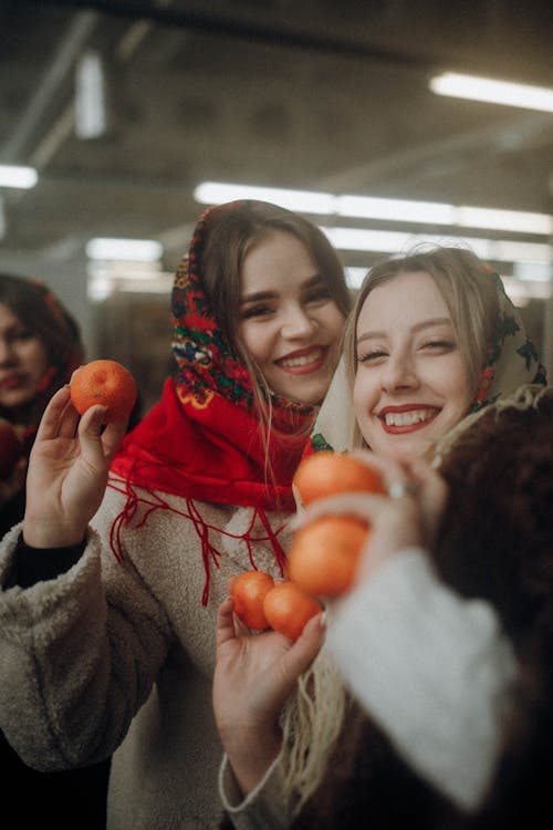 Young Women with Clementines in Hands