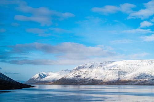 View of the Sea and Snowy Fjords 