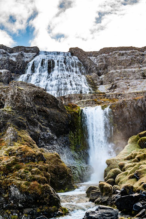 Waterfall on Cliff in Mountains Landscape