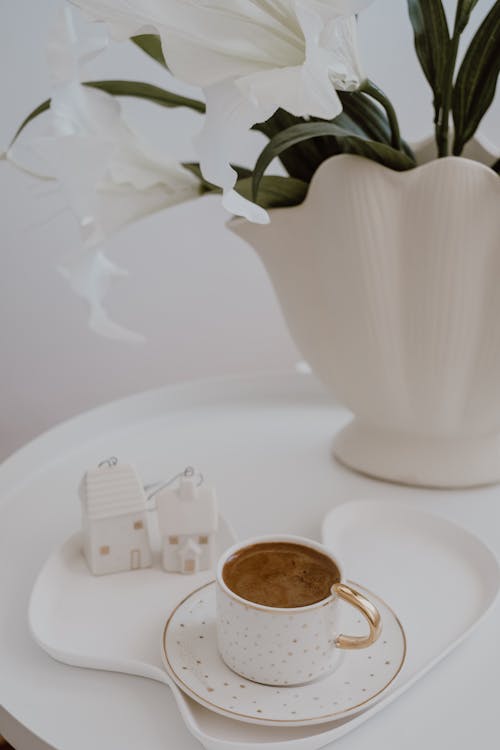 Free Cup of Coffee on Tray with Baubles in Shape of House Stock Photo