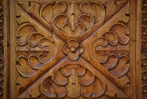Free Close-up of a detailed wooden carving showcasing decorative patterns and craftsmanship. Stock Photo