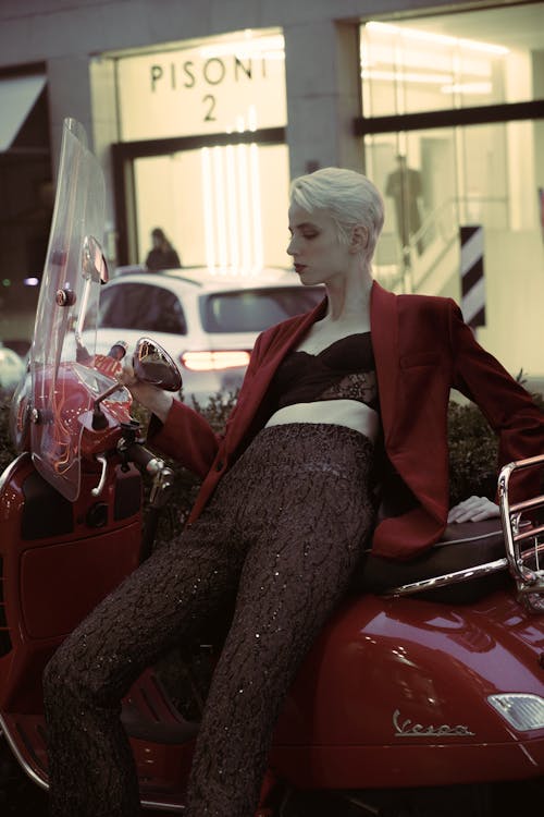 Female Model Leaning on a Motor Scooter