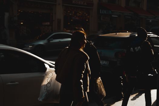 People on a Street in Sunlight 