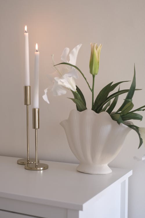Candles and a Vase with Flowers